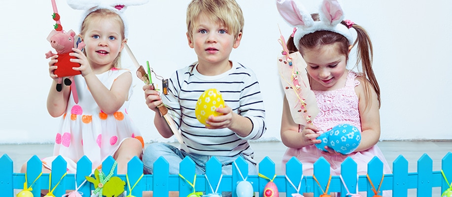 kids holding easter candles