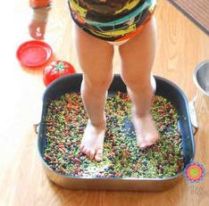 feet in plastic box with beans