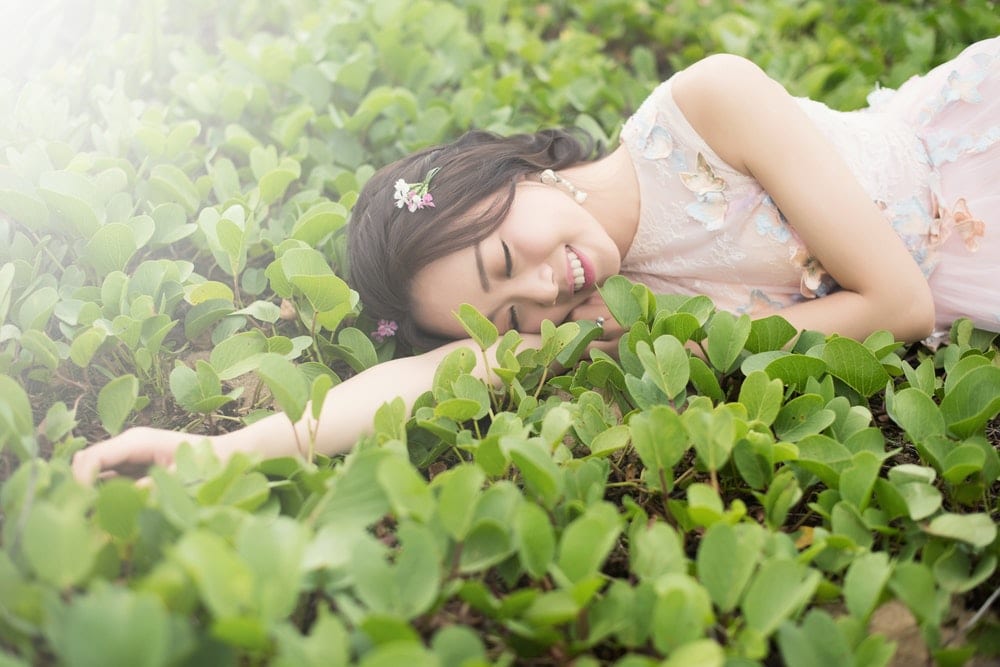 woman lying on grass